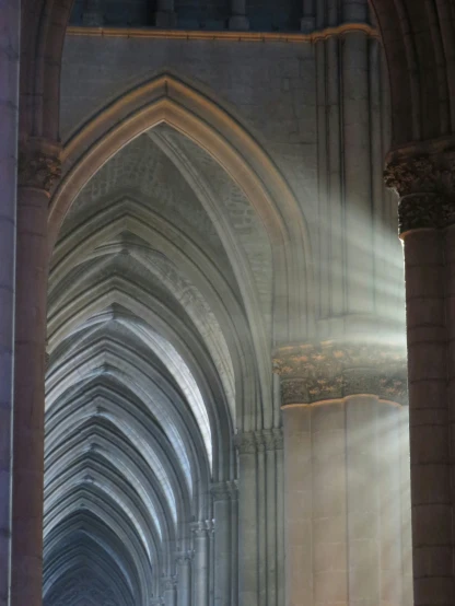 sunlight shining through the arches in the building