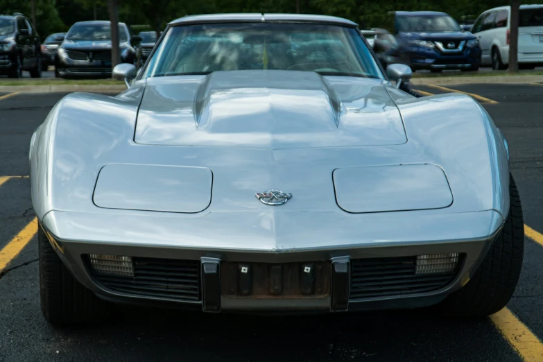 a chevrolet corvette corvette sports car parked in a parking lot