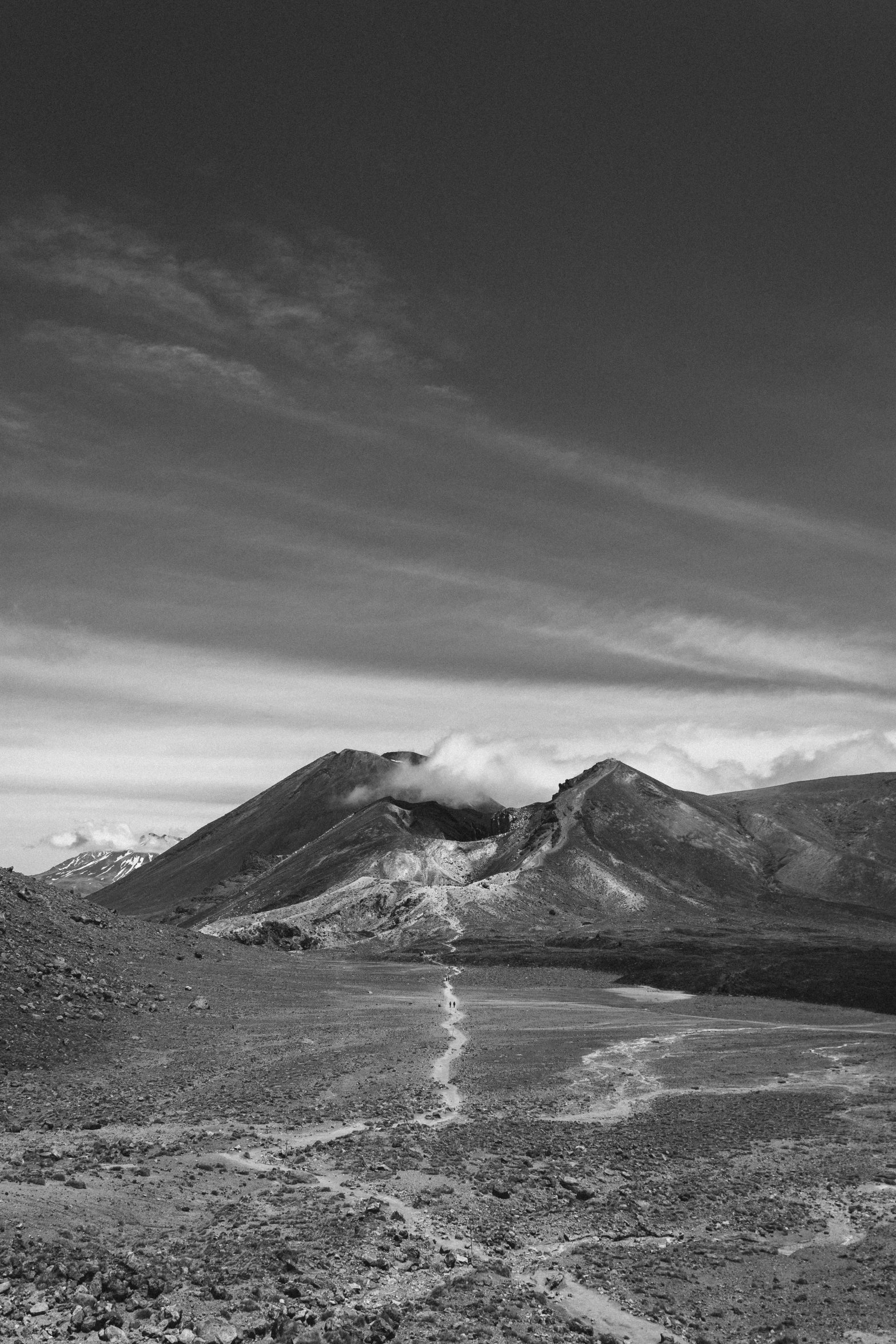 a black and white po of snow capped mountains