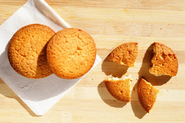 a few cookies are sliced in half and sit on top of a paper towel