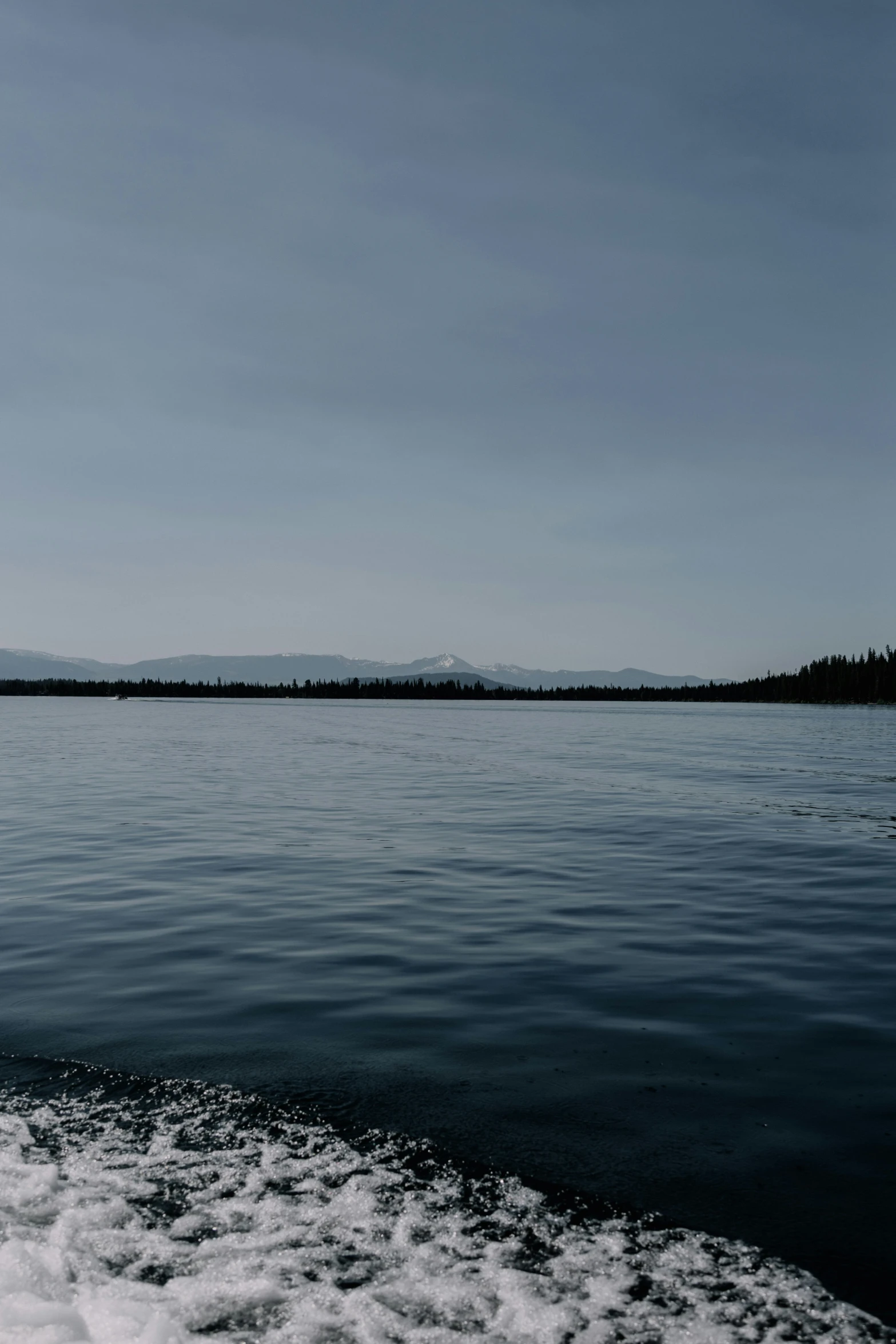 an image of a boat traveling along water