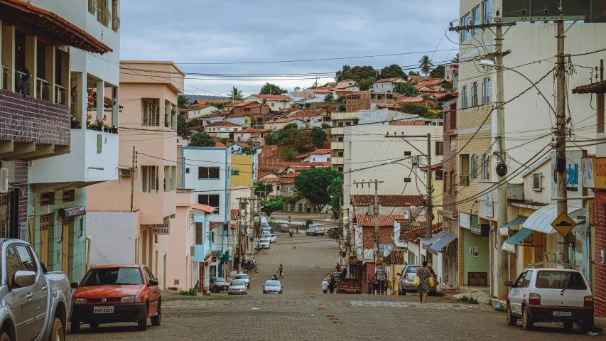 this is an urban setting with several buildings and cars on the street