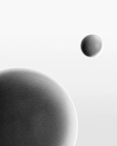 two black objects floating in the air in a circular pattern