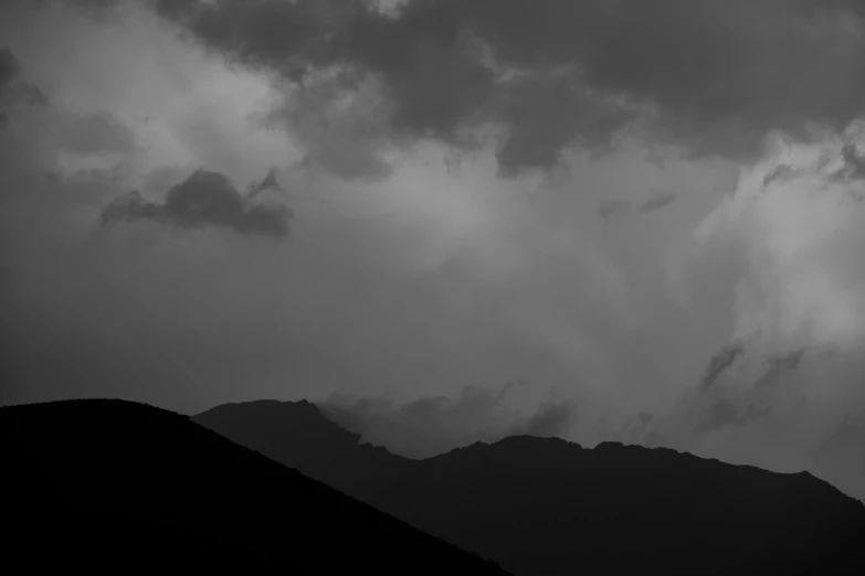 a jetliner flying through a dark cloudy sky