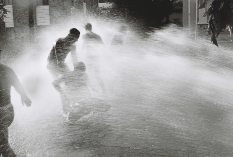 a man is standing in the water spraying