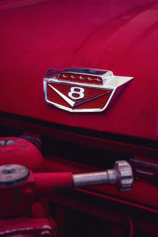 a red cadillac logo is shown on the hood