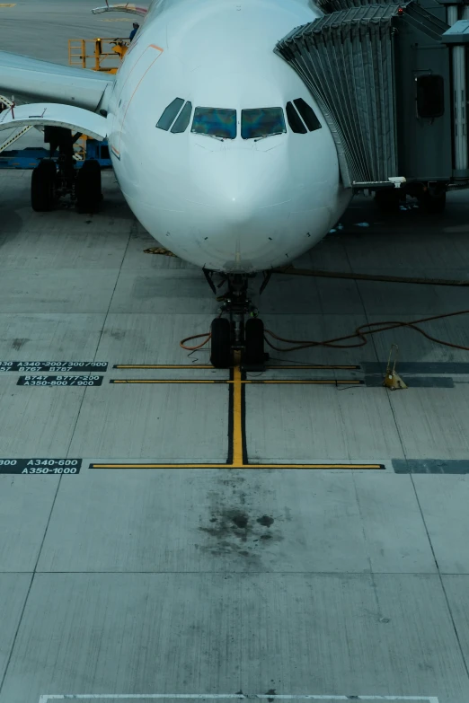 a jumbo jet sits parked at an airport