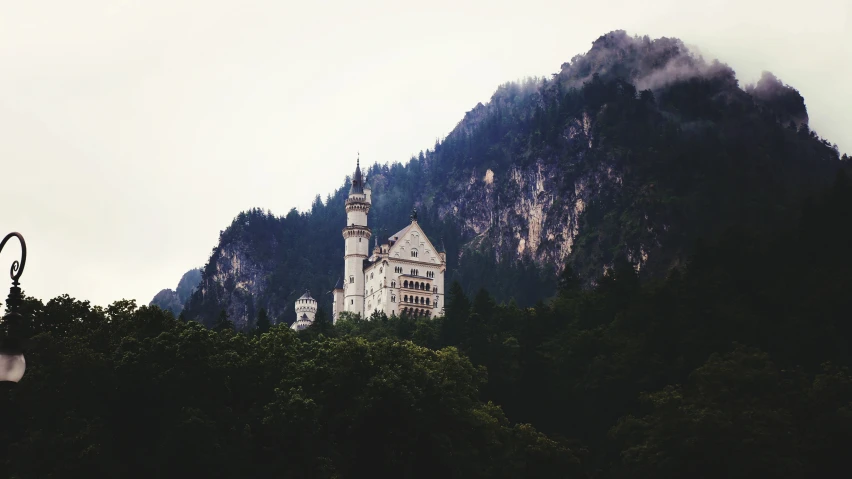 a church is in the background in front of the mountains