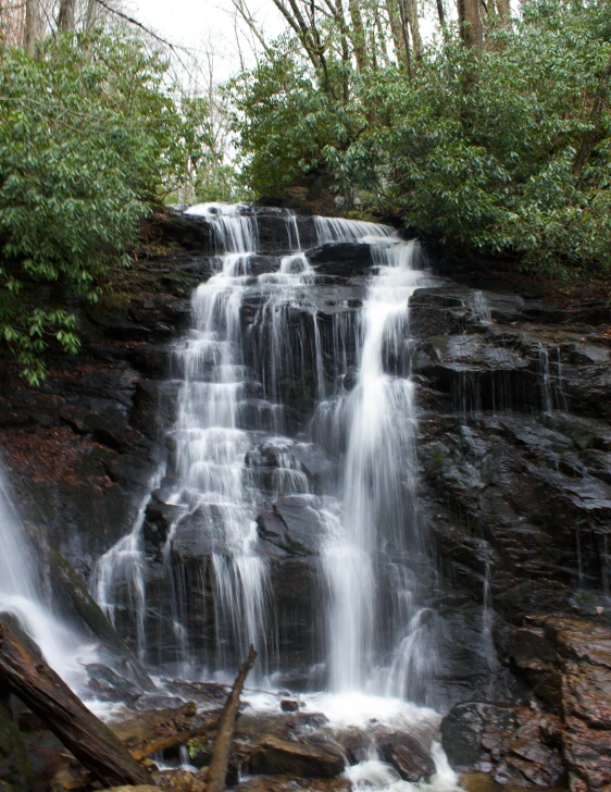 there is a large waterfall in the woods