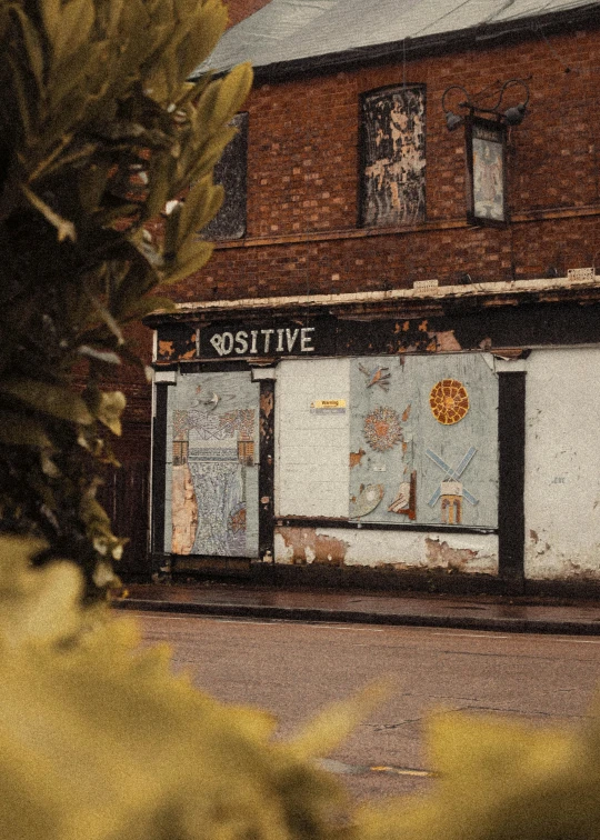 an empty building with two doors closed in the street