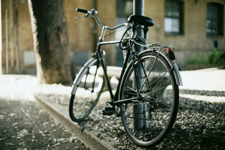 a bike is  up on the street corner