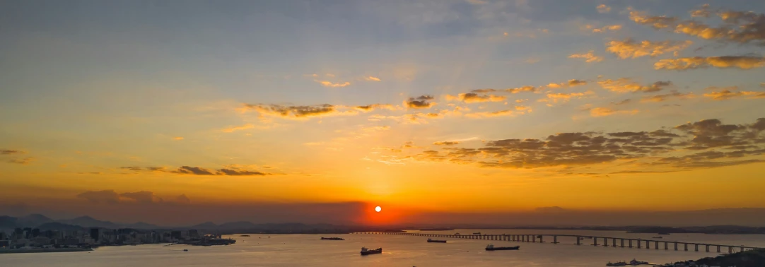 boats on the water as the sun sets