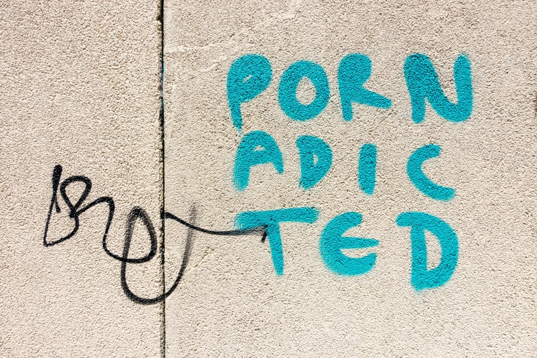 some graffiti writing on the side of a building