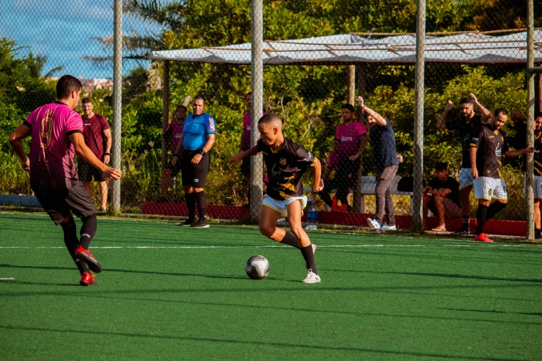 some people are playing soccer on a field