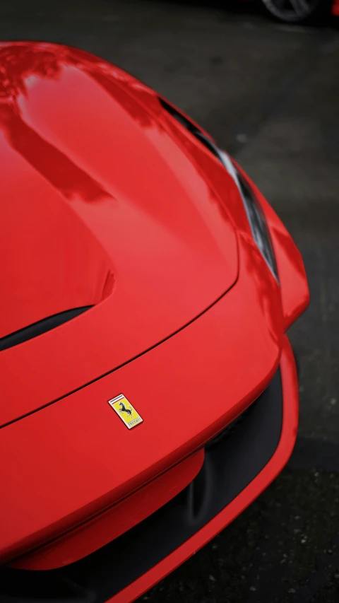 a close up of the side of a red sports car