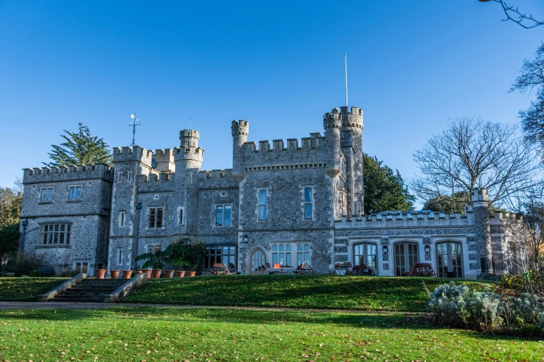 the back of a castle with trees in the background