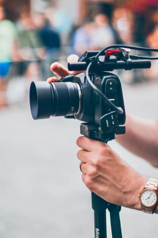 a camera being attached to a bicycle for filming