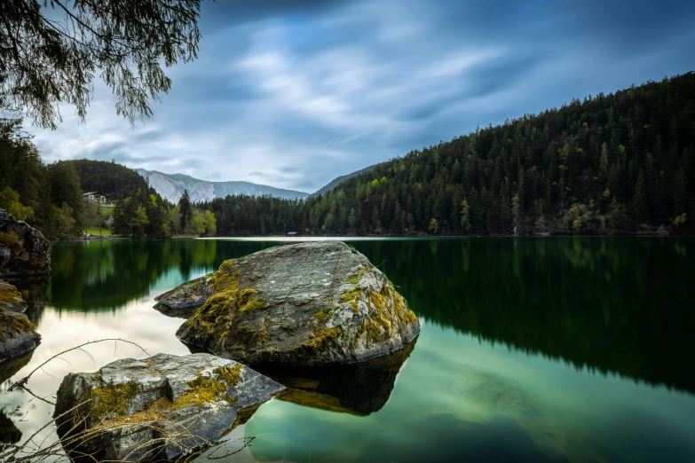 two large rocks in the middle of a body of water