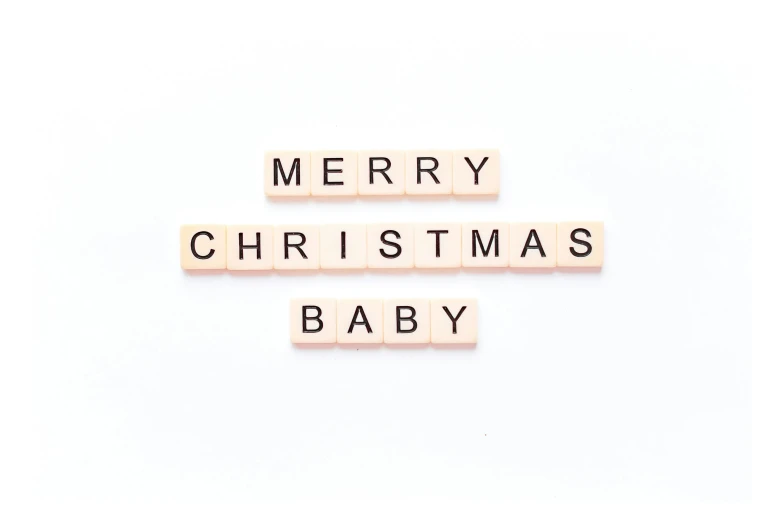 wooden letters spelling merry christmas baby and a block saying merry christmas