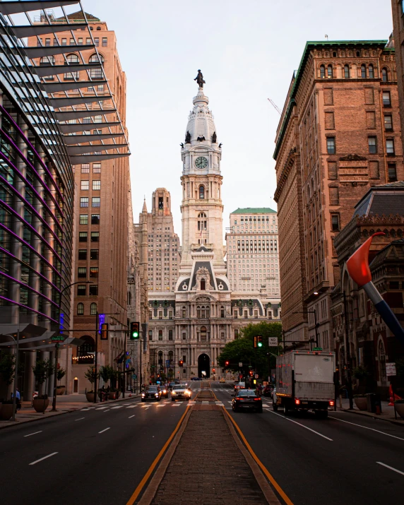 the city street with buildings and traffic lights