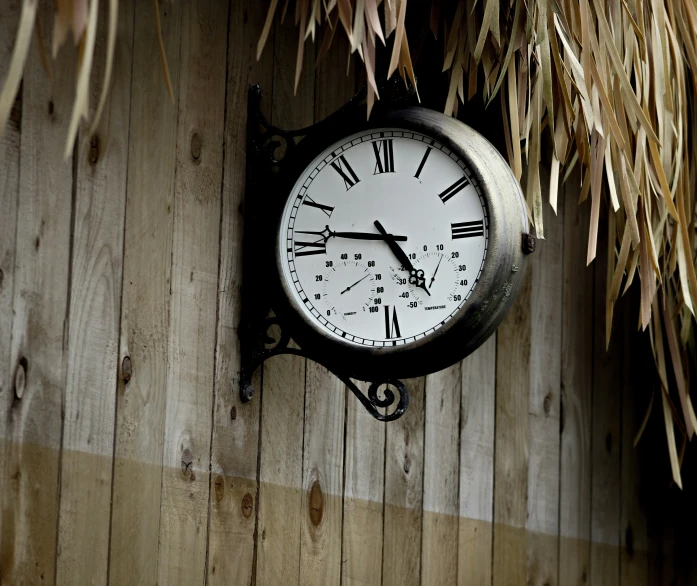 a small clock on the side of a building