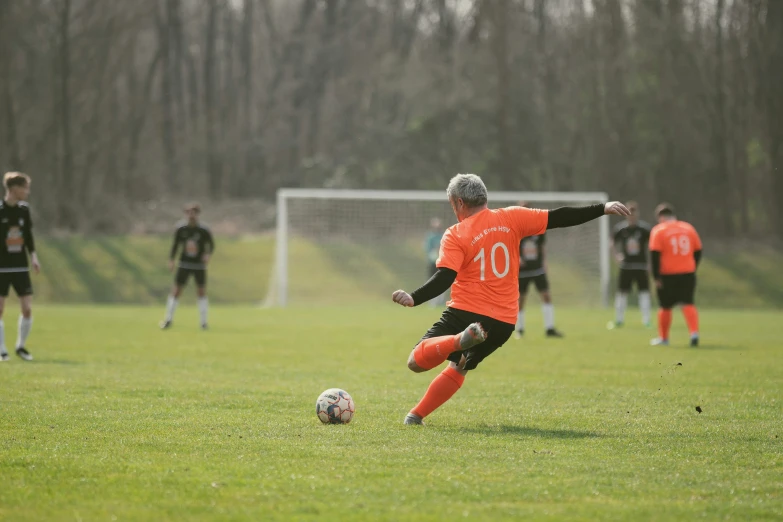 a group of boys are playing soccer on a field