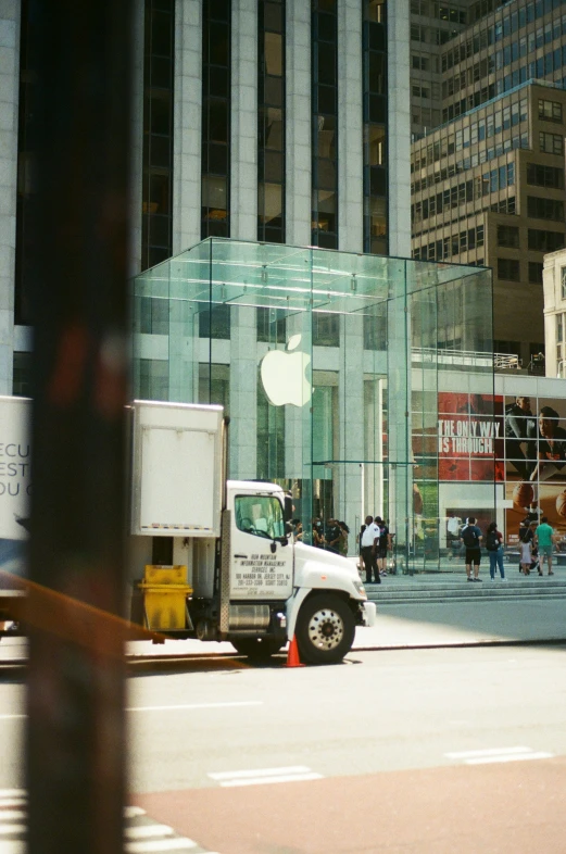 a truck is sitting in front of some buildings