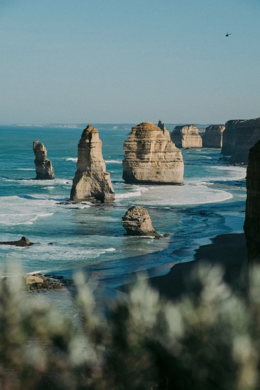 there are two large rocks in the ocean next to each other