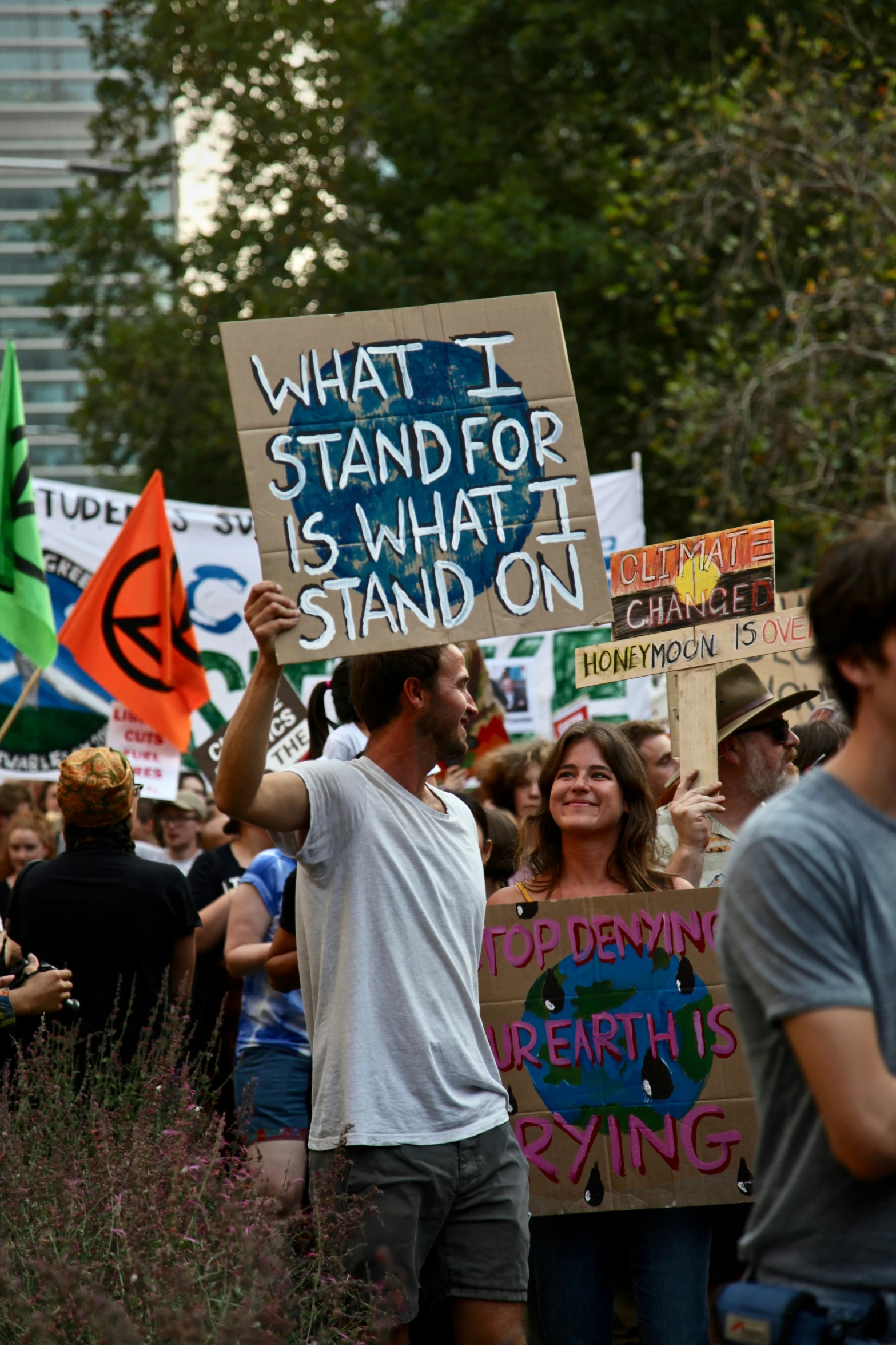 a crowd of people with signs holding up a sign