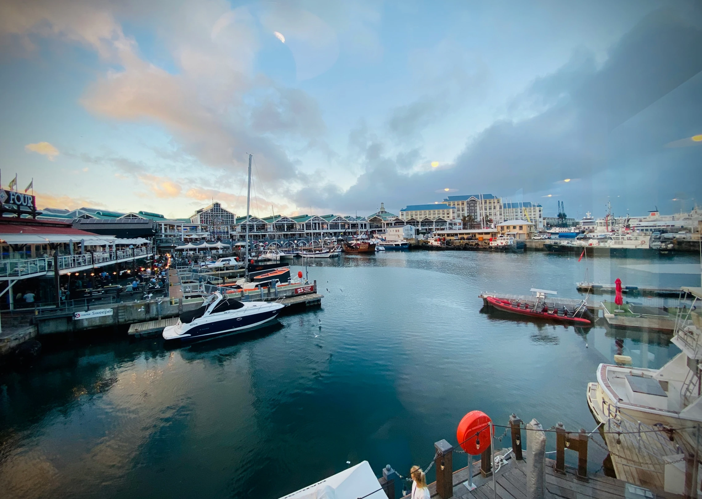 a marina in an ocean with small boats