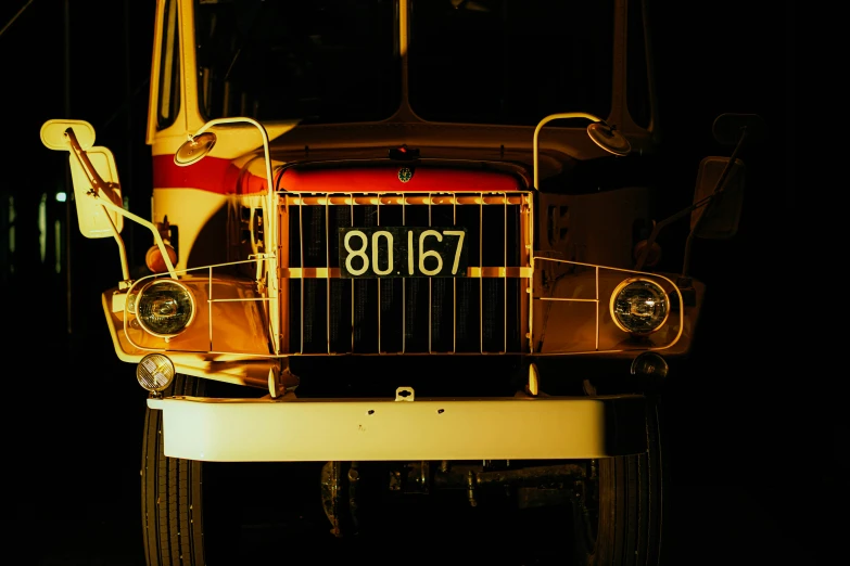 a semi truck cab with its hood open in the dark