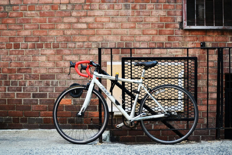 a bike is  up to the side of the building