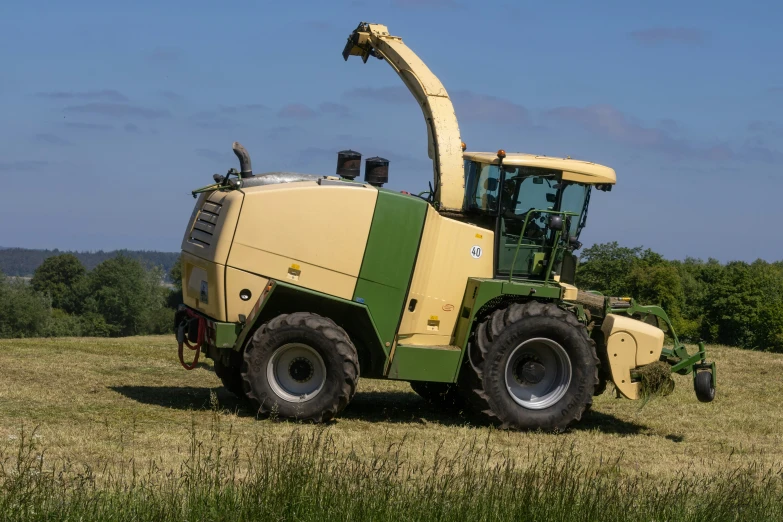 a combine tractor is parked in a field