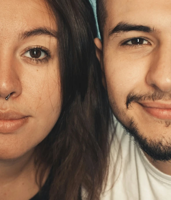 a man and woman with fake piercings posing for a picture