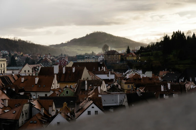 an image of some houses in the middle of a mountain range