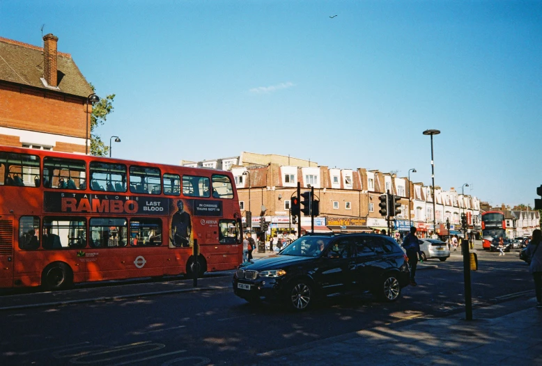 a double decker bus driving down a city street