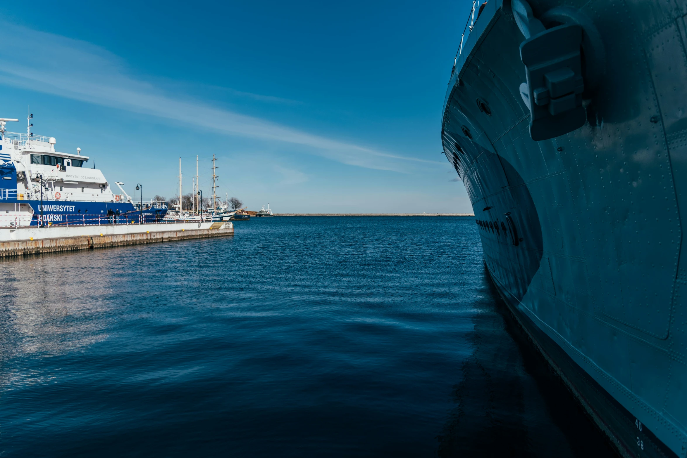 a boat is parked next to another in the ocean