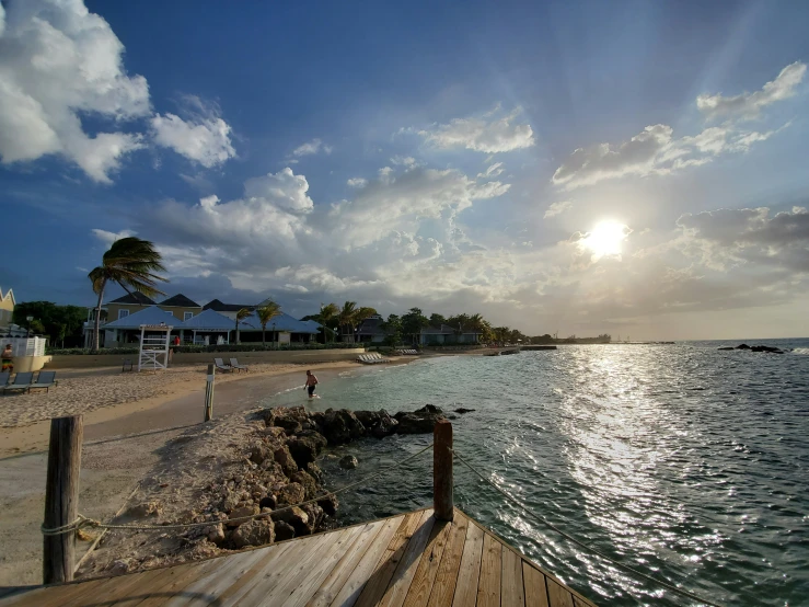 there is a beach and many houses along the water