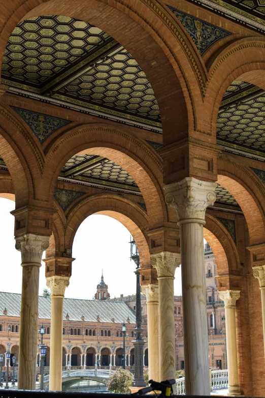 arches in a stone building that has several columns