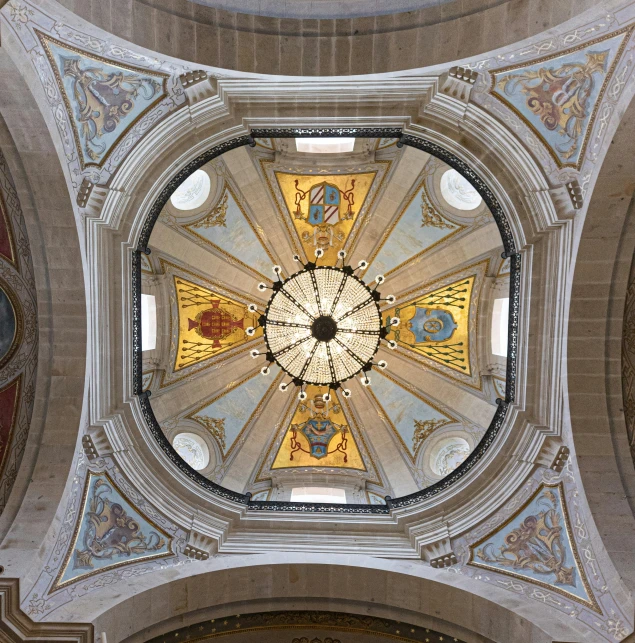 a dome containing a mosaic in a building