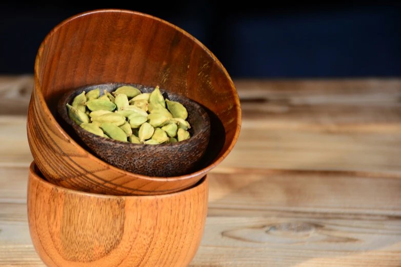 a wooden bowl filled with different kinds of food