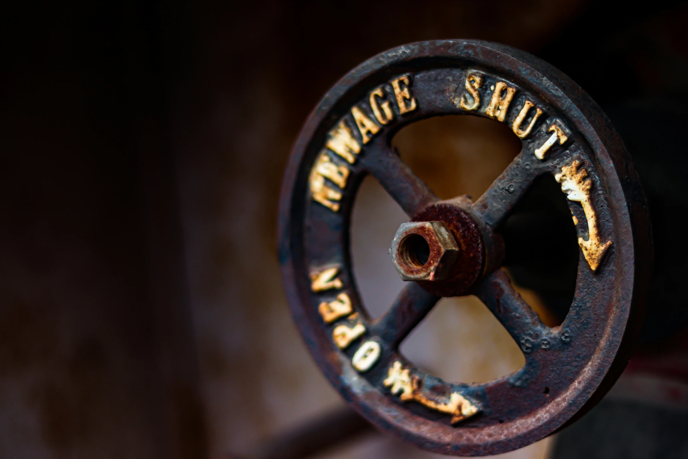 a rusted sign that reads damage shut now