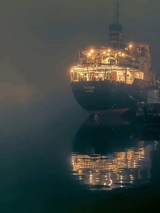 a large ship in the water at night