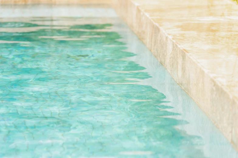 a pool with blue water in the back