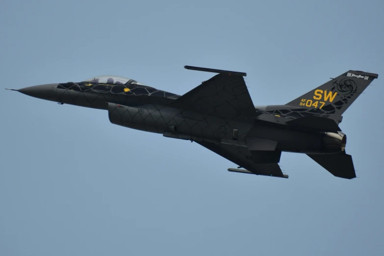 an air force jet flying in the sky