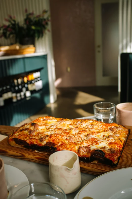 a thick pizza that is sitting on a table