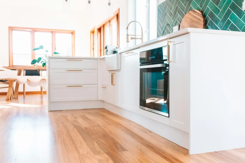 this is an image of a kitchen with wood floors