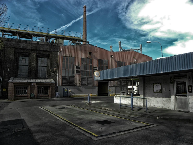 there is a old factory building and a deserted street