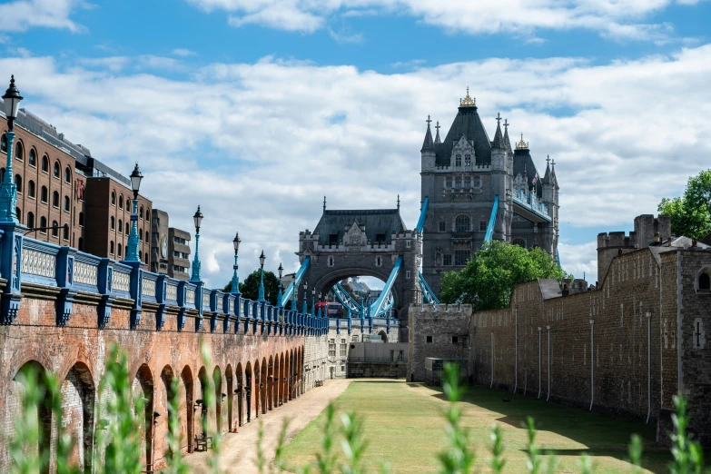 a walkway to the tower bridge on a clear day