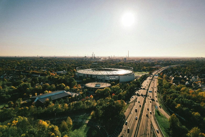 view from an airplane of a stadium stadium and road